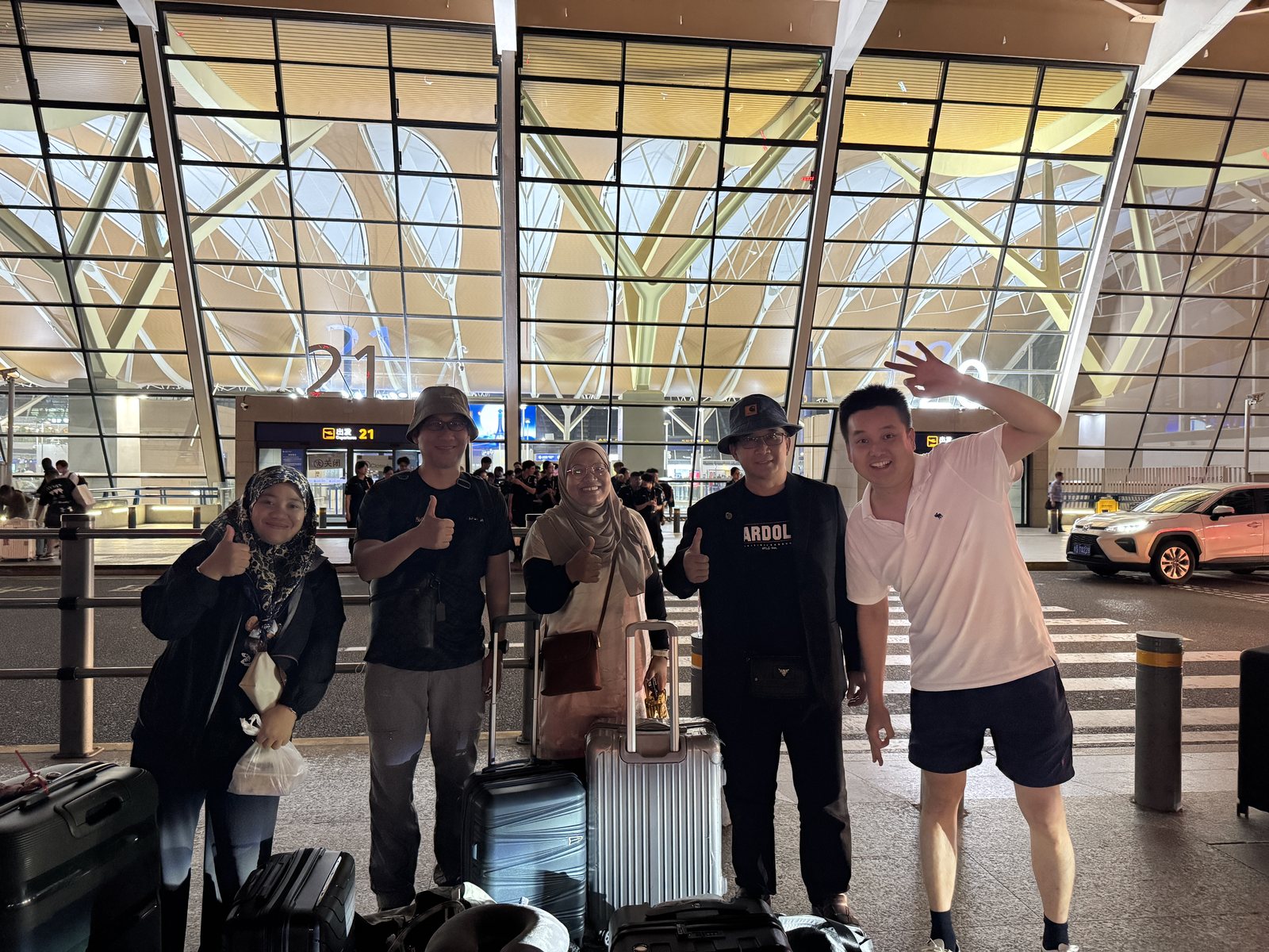 International guests arriving at a Shanghai airport with luggage