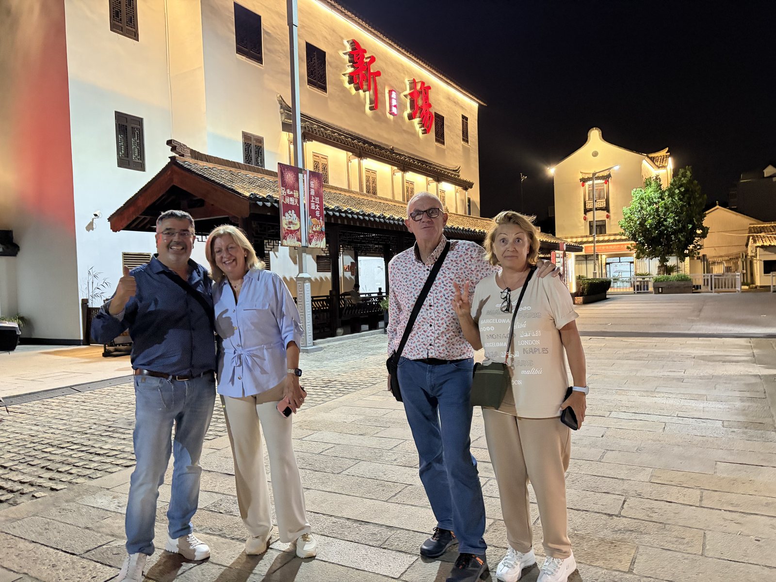 International visitors exploring an evening destination with a local host